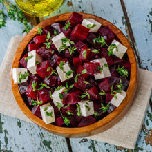 A bowl of salad with chopped lutz green leaf beets ready to eat.