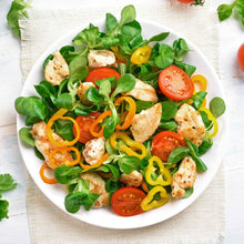 A salad made using Mache Corn Salad lettuce with pepper and tomatoes.
