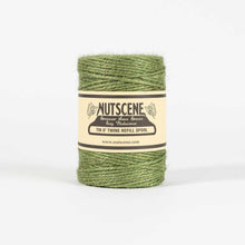 Green twine spool with Nutscene label on a white background