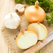 Onion set sweet pentium on a wooden surface with a knife