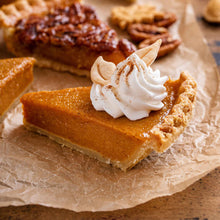 A slice of Kentucky Field pumpkin pie with a dollop of whipped cream.