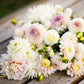 Romantic Mix dahlia bouquet displaying the vibrant colors of white and pink.
